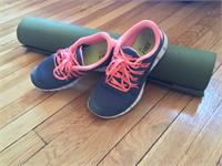 running shoes and yoga mat